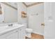 Simple bathroom with white vanity, toilet, and mirror at 5096 Capulet Circle, Myrtle Beach, SC 29588