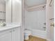 Clean bathroom with white vanity, bathtub, and tiled floor at 5096 Capulet Circle, Myrtle Beach, SC 29588