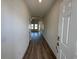 Inviting entryway featuring wood-look flooring and views into the spacious living area at 541 Honeyhill Loop, Conway, SC 29526