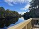 Riverfront view from a deck with wooden railings at 541 Honeyhill Loop, Conway, SC 29526