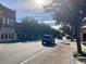 Charming street view featuring trees adorned with decorative pumpkins, vintage architecture and local shops at 556 Honeyhill Loop, Conway, SC 29526
