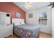 Bedroom with floral comforter and ensuite bathroom at 6001 - 1563 S Kings Hwy., Myrtle Beach, SC 29575