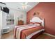 Comfortable bedroom with a striped comforter and coastal decor at 6001 - 1563 S Kings Hwy., Myrtle Beach, SC 29575