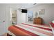 Bedroom with striped comforter, dresser, and en-suite bathroom at 6001 - 1563 S Kings Hwy., Myrtle Beach, SC 29575