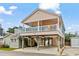 Two-story beach house with a wrap-around deck and parking underneath at 6001 - 1563 S Kings Hwy., Myrtle Beach, SC 29575