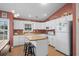 Modern kitchen features white cabinetry and a spacious island at 6001 - 1563 S Kings Hwy., Myrtle Beach, SC 29575