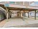 Under-house parking area for beach house with concrete floor at 6001 - 1563 S Kings Hwy., Myrtle Beach, SC 29575