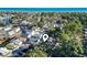Aerial shot of the neighborhood with a lake visible, nestled among lush trees with the ocean visible at 6001 South Kings Hwy., Myrtle Beach, SC 29575