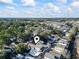 Aerial view of the neighborhood, nestled among lush trees, with commerce area visible in the distance at 6001 South Kings Hwy., Myrtle Beach, SC 29575