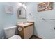 Well lit half bath with a light blue walls at 6001 South Kings Hwy., Myrtle Beach, SC 29575