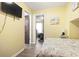 View of bedroom showing TV and connection to other rooms in house at 6001 South Kings Hwy., Myrtle Beach, SC 29575