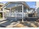 Close-up of the beach house showing the covered porch and the adjacent grill area at 6001 South Kings Hwy., Myrtle Beach, SC 29575
