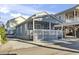Charming single-story beach house with a spacious covered porch and beachy blue siding at 6001 South Kings Hwy., Myrtle Beach, SC 29575