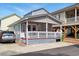Charming beach cottage featuring a cozy front porch and a well-maintained exterior at 6001 South Kings Hwy., Myrtle Beach, SC 29575