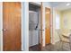 Efficient laundry closet with stacked washer and dryer, conveniently located near the kitchen at 6001 South Kings Hwy., Myrtle Beach, SC 29575