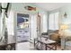 Cozy living room with hardwood floors, comfortable seating, and a view of the porch at 6001 South Kings Hwy., Myrtle Beach, SC 29575