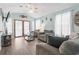 Comfortable living room with coastal decor and a view of the outdoors through large windows at 6001 South Kings Hwy., Myrtle Beach, SC 29575
