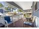 View of the large and cozy porch with table and chairs for outdoor dining and relaxing at 6001 South Kings Hwy., Myrtle Beach, SC 29575