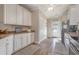 Well-equipped kitchen boasting white cabinets and wood flooring at 6001-1041 S Kings Hwy., Myrtle Beach, SC 29575