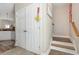 Elegant staircase with white doors and wood flooring at 6001-1041 S Kings Hwy., Myrtle Beach, SC 29575