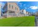 Landscaped backyard with grassy area and neighboring houses at 6001-1909 S Kings Hwy., Myrtle Beach, SC 29575