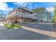 Elevated beach house with large deck, carport, and fenced yard at 6001-1909 S Kings Hwy., Myrtle Beach, SC 29575