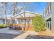 House front view with a wooden deck and American Flag at 6001-5732 S Kings Hwy., Myrtle Beach, SC 29575