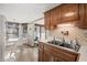 Galley kitchen with wood cabinets and modern appliances at 6001-5732 S Kings Hwy., Myrtle Beach, SC 29575
