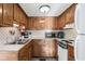 Galley kitchen with wood cabinets and modern appliances at 6001-5732 S Kings Hwy., Myrtle Beach, SC 29575