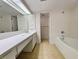 Bright bathroom features a large countertop and storage space, with a tub and shower combination at 645 Retreat Beach Circle, Pawleys Island, SC 29585