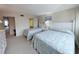Comfortable bedroom features two twin beds, soft lighting, and access to the living area at 645 Retreat Beach Circle, Pawleys Island, SC 29585
