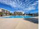Bright community pool with clear blue water near the beach and beautiful high-rise buildings at 645 Retreat Beach Circle, Pawleys Island, SC 29585