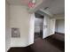 Hallway view of an elevator with a trash chute and exit sign above the door to the elevator at 645 Retreat Beach Circle, Pawleys Island, SC 29585