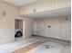 View of a one car garage with reserved parking and storage space on the right side of the garage at 645 Retreat Beach Circle, Pawleys Island, SC 29585