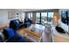 Cozy living room with stylish blue furniture and ocean views at 645 Retreat Beach Circle, Pawleys Island, SC 29585