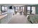 Spacious main bedroom features a large window, comfortable seating, balcony access, and a dresser at 645 Retreat Beach Circle, Pawleys Island, SC 29585