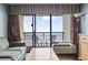 Living room with ocean view and balcony access at 6804 N Ocean Blvd. # 617, Myrtle Beach, SC 29572