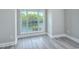 Bedroom with large window overlooking water at 70 Addison Cottage Way # 319, Murrells Inlet, SC 29576