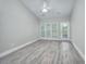 Bright bedroom with wood-look floors and access to balcony at 70 Addison Cottage Way # 319, Murrells Inlet, SC 29576