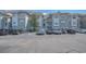 Exterior view of a condo building with parking lot and landscaping at 70 Addison Cottage Way # 319, Murrells Inlet, SC 29576