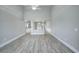 Spacious living room featuring high ceilings and wood-look floors at 70 Addison Cottage Way # 319, Murrells Inlet, SC 29576