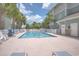 Community pool with lounge chairs for relaxation at 70 Addison Cottage Way # 319, Murrells Inlet, SC 29576