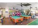 Spacious game room featuring billiard tables and a variety of modern arcade games at 7100 Ocean Blvd. # 223, Myrtle Beach, SC 29572