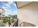 Balcony with a seating area overlooking palm trees, other buildings, and a blue sky at 7100 Ocean Blvd. # 223, Myrtle Beach, SC 29572