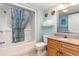 Bathroom featuring a shower/tub combo, vanity with granite top, and coastal-themed decor at 7100 Ocean Blvd. # 223, Myrtle Beach, SC 29572