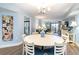 Bright dining area with round table and chairs, adjacent to the living room at 7100 Ocean Blvd. # 223, Myrtle Beach, SC 29572