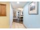 Hallway showcasing tile flooring, soothing blue walls, and a glimpse into the dining area at 7100 Ocean Blvd. # 223, Myrtle Beach, SC 29572