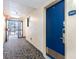 Well-lit hallway showing unit entry door and exit access at 7100 Ocean Blvd. # 223, Myrtle Beach, SC 29572