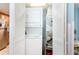 Compact laundry room with stacked washer and dryer, and HVAC unit at 7100 Ocean Blvd. # 223, Myrtle Beach, SC 29572