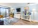 Bright living room with a balcony access, and coastal decor at 7100 Ocean Blvd. # 223, Myrtle Beach, SC 29572